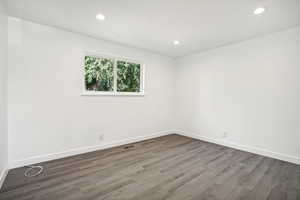 Unfurnished room featuring hardwood / wood-style floors