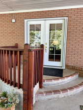 View of back french doors and double sliding screen from kitchen to patio entrance