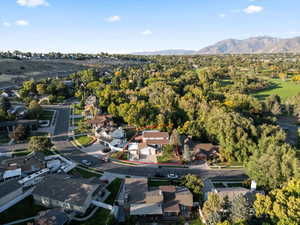 Aerial photo showing Front of property with approx lot lines, Near Golf Course and above Wooded Stream