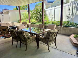 View of patio with an outdoor hangout area