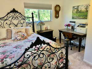 Bedroom with great views from window,  light colored carpet