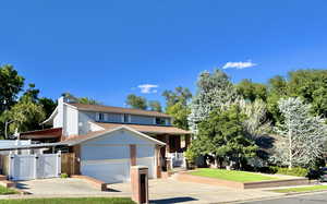 Front exterior with a 3 car garage