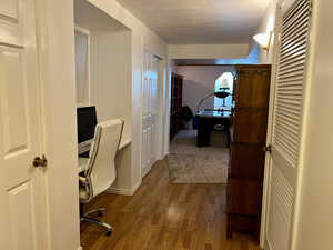 Basement open Office nook, featuring a built in desk