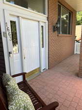 View of entrance to property and large, covered front porch