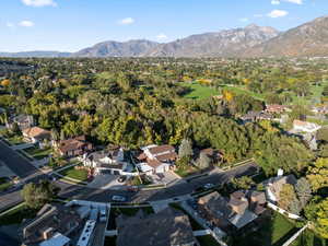 Aerial of house, neighborhood, and nearby Hidden Valley Club Golf Course.