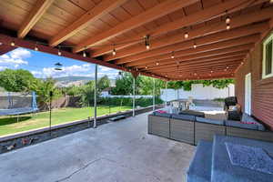 View of patio with a trampoline and outdoor lounge area