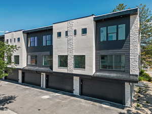 View of building exterior featuring a garage