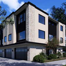 View of building exterior with a garage