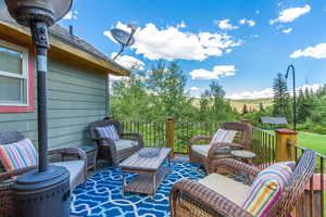 View of patio with an outdoor hangout area