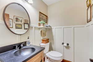 Bathroom featuring vanity and toilet