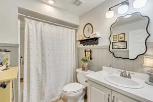 Bathroom featuring toilet and vanity