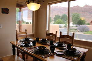 Dining area with natural light and beautiful views of Moab Rim