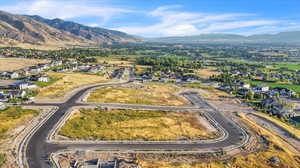 Birds eye view of property with a mountain view