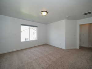 View of carpeted spare room