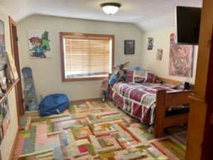 Bedroom featuring vaulted ceiling