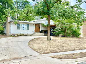 View of front of home with a carport