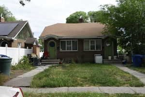 Bungalow-style house featuring solar panels