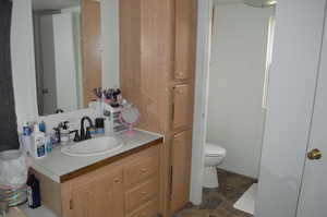 Bathroom with vanity and toilet