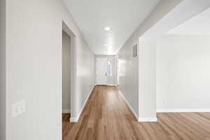 Hall featuring light hardwood / wood-style floors