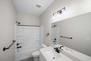 Full bathroom with tile patterned floors, vanity, toilet, and shower / bath combination