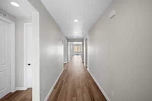 Corridor featuring light hardwood / wood-style floors