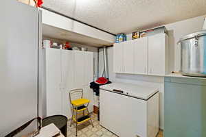 Washroom featuring a textured ceiling