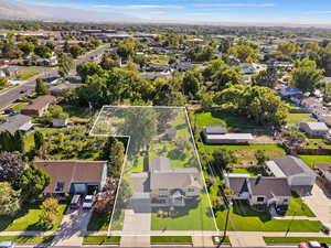 Birds eye view of property with a mountain view