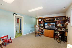 View of carpeted home office