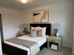 Photo of the Dawson Place model home, showing furnished example of similar floorplan. Bedroom #2.