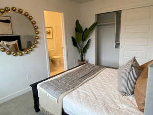 Photo of the Dawson Place model home, showing furnished example of similar floorplan. Bedroom #2 with ensuite.