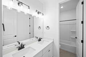 Full bathroom featuring tile patterned flooring, vanity, toilet, and shower / bathtub combination