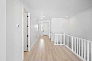 Corridor featuring light hardwood / wood-style flooring