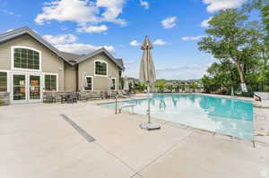 View of community swimming pool and clubhouse