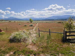 Property view of mountains with a rural view