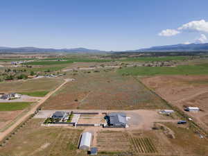 Birds eye view of property featuring a rural view and a mountain view