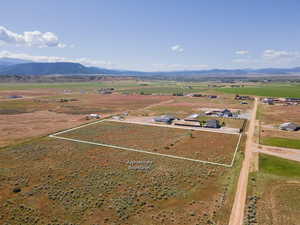 Birds eye view of property with a rural view and a mountain view