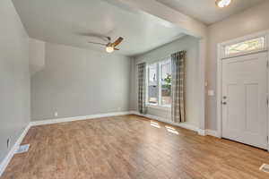 Spacious living room upon stepping inside.