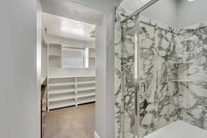 Looking from the main bedroom, past the ensuite 3/4 bath, onto the huge walk in closet.