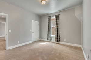 Bedroom one with a closet and window on the North wall.