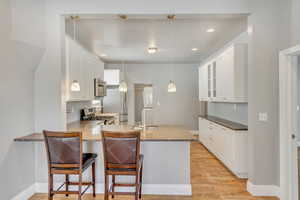 Hard surface countertops that last and two bar stools.