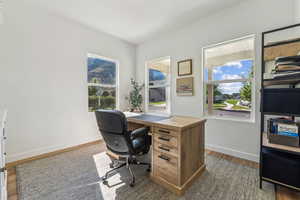 Office space with dark wood-type flooring