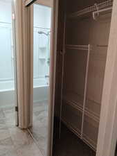 Current photo of upstairs bathroom and closet.