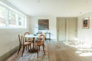 Dining room with hardwood / wood-style flooring