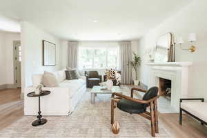 Living room with light hardwood / wood-style flooring