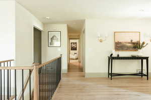 Hall featuring light wood-type flooring