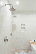 Bathroom featuring shower with separate bathtub