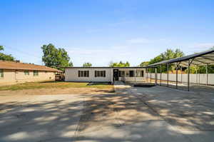 View of front facade featuring a carport