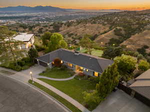 Aerial view at dusk featuring a mountain and valley view