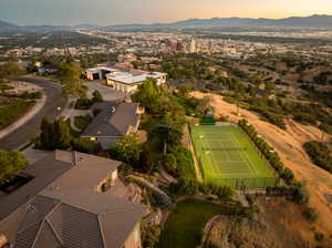 Aerial view at dusk featuring a mountain and city view