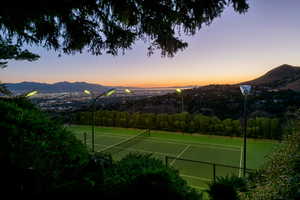 View of tennis court and sunset over Great Salt Lake